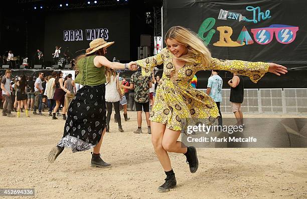 Festival goers dance as Circa Waves perform at the amphitheatre stage at Splendour In the Grass 2014 on July 26, 2014 in Byron Bay, Australia.