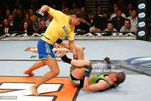 Julianna Pena punches Jessica Rakoczy in their women's bantamweight final fight during The Ultimate Fighter season 18 live finale inside the Mandalay...