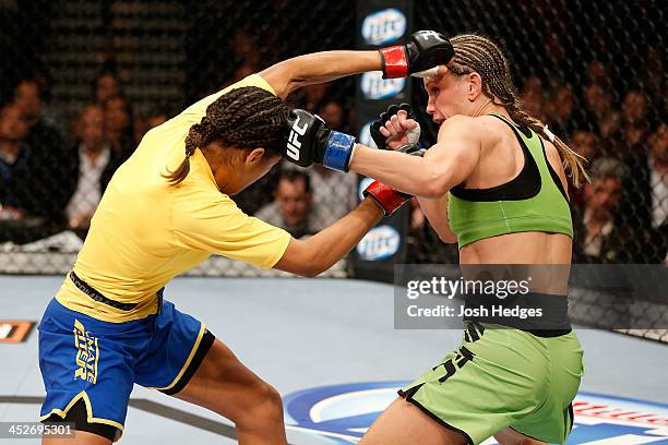 Julianna Pena punches Jessica Rakoczy in their women's bantamweight final fight during The Ultimate Fighter season 18 live finale inside the Mandalay...