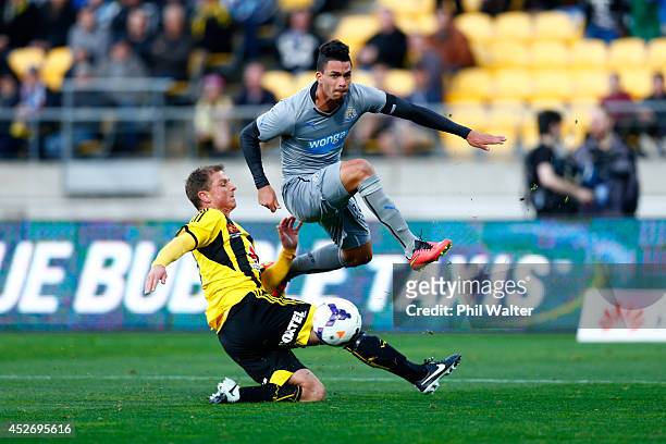 Emmanuel Riviere of Newcastle shoots over Ben Sigmund of the Phoenix during the Football United New Zealand Tour match between the Wellington Phoenix...