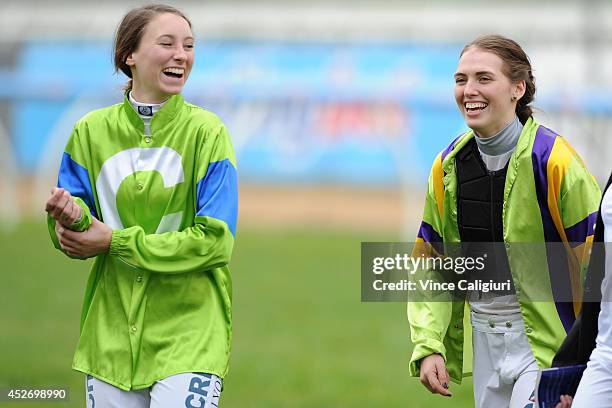 Katelyn Mallyon and Kayla Nisbet react after walking the track during Melbourne Racing at Caulfield Racecourse on July 26, 2014 in Melbourne,...