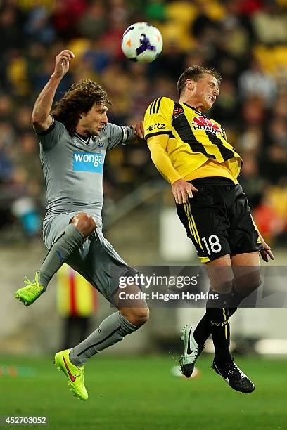 Ben Sigmund of the Phoenix and Fabricio Coloccini of Newcastle United compete for a header during the Football United New Zealand Tour 2014 match...