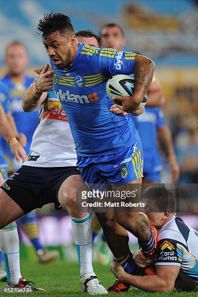 Kenny Edwards of the Eels is tackled during the round 20 NRL match between the Gold Coast Titans and the Parramatta Eels at Cbus Super Stadium on...