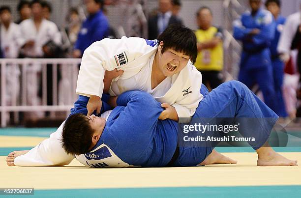 Sara Asahina of Japan and Sisi Ma of China compete in the women's +78kg quater-final match during day three of the Judo Grand Slam at the on December...