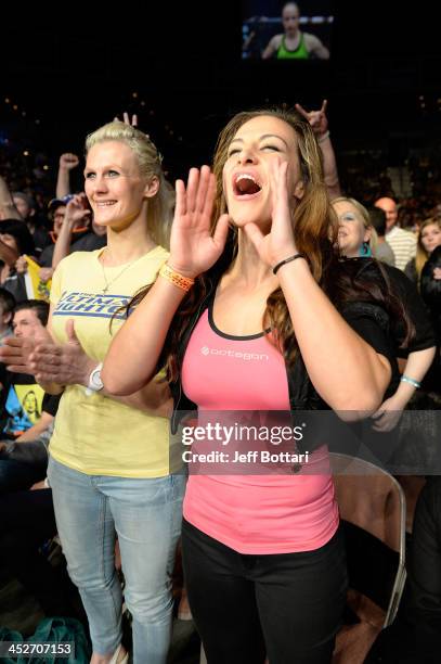 Women's bantamweight fighter Miesha Tate cheers on Julianna Pena during her women's bantamweight final fight against Jessica Rakoczy during The...