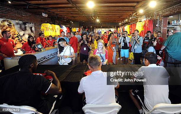 Pilippe Coutinho, Kolo Toure, Steven Gerrard of Liverpool attend a signing session at World Futbal Boston on July 25, 2014 in Boston, Massachusetts.