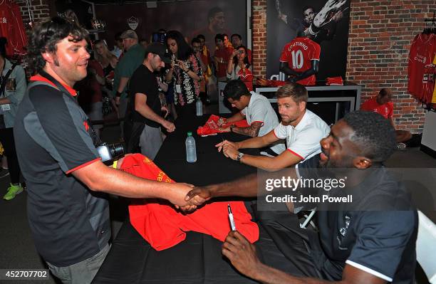 Pilippe Coutinho, Kolo Toure, Steven Gerrard of Liverpool attend a signing session at World Futbal Boston on July 25, 2014 in Boston, Massachusetts.