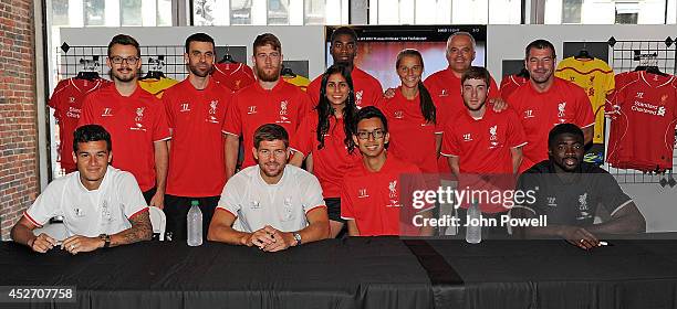 Pilippe Coutinho, Kolo Toure, Steven Gerrard of Liverpool attend a signing session at World Futbal Boston on July 25, 2014 in Boston, Massachusetts.