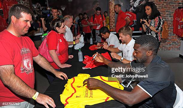 Pilippe Coutinho, Kolo Toure, Steven Gerrard of Liverpool attend a signing session at World Futbal Boston on July 25, 2014 in Boston, Massachusetts.