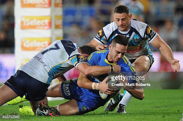 Corey Norman of the Eels scores a try during the round 20 NRL match between the Gold Coast Titans and the Parramatta Eels at Cbus Super Stadium on...