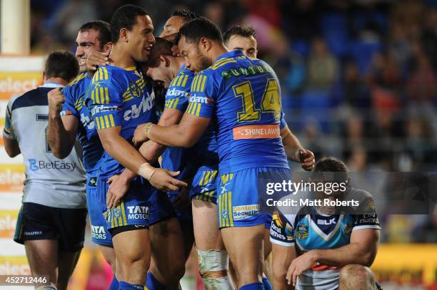 Corey Norman of the Eels celebrates scoring a try with team mates during the round 20 NRL match between the Gold Coast Titans and the Parramatta Eels...
