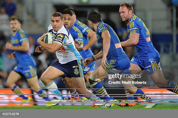 Maurice Blair of the Titans runs the ball during the round 20 NRL match between the Gold Coast Titans and the Parramatta Eels at Cbus Super Stadium...
