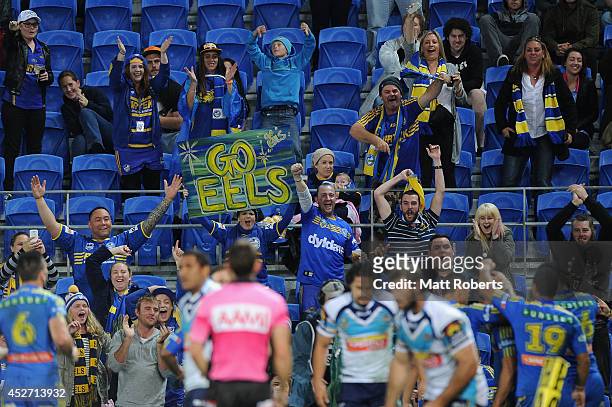 Eels fans cheer after a try by Jarryd Hayne of the Eels during the round 20 NRL match between the Gold Coast Titans and the Parramatta Eels at Cbus...