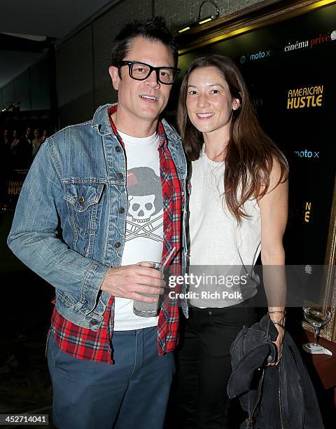 Actor Johnny Knoxville and Naomi Nelson attend PANDORA Jewelry and Moto X present 'American Hustle' at cinema prive at on November 30, 2013 in West...