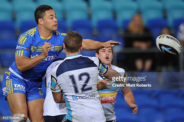 Jarryd Hayne of the Eels knocks the ball back during the round 20 NRL match between the Gold Coast Titans and the Parramatta Eels at Cbus Super...