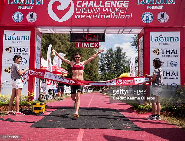 Tamsin Lewis of Great Britain celebrates third position after run leg during the Phuket leg of Challenge 2013 on December 1, 2013 in Phuket, Thailand.