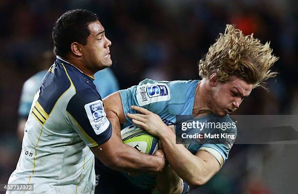 Michael Hooper of the Waratahs is tackled during the Super Rugby Semi Final match between the Waratahs and the Brumbies at Allianz Stadium on July...