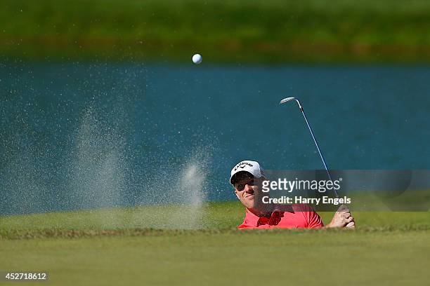 David Horsey of England chips out of a bunker at the eighteenth on day three of the M2M Russian Open at Tseleevo Golf & Polo Club on July 26, 2014 in...