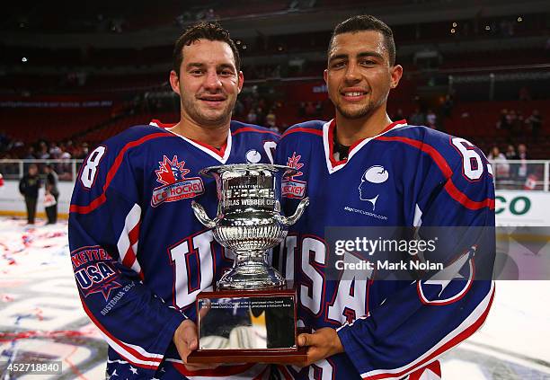 Zenon Konopka and Emerson Etem of the USA pose with the Douglas Webber Cup after winning the International Ice Hockey Series between the United...