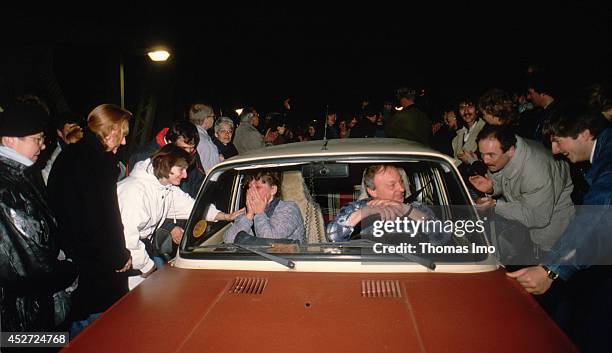 Trabant is welcomed by people at the former inner German border after opening of the border on November 09 in Berlin, Germany. The year 2014 marks...