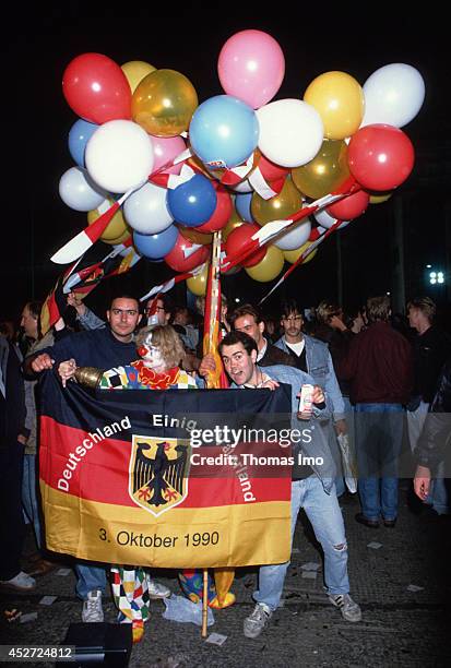 People celebrating German Unity Day in Berlin, Germany 3rd October 1990.