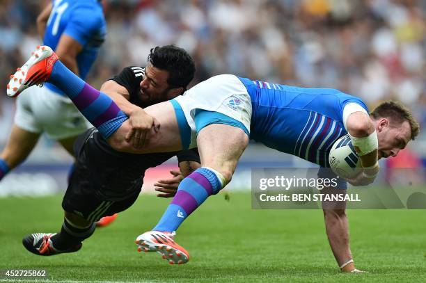 New Zealand's Sherwin Stowers tackles Scotland's Stuart Hogg during the Rugby Sevens pool A match between Scotland and New Zealand at Ibrox Stadium...