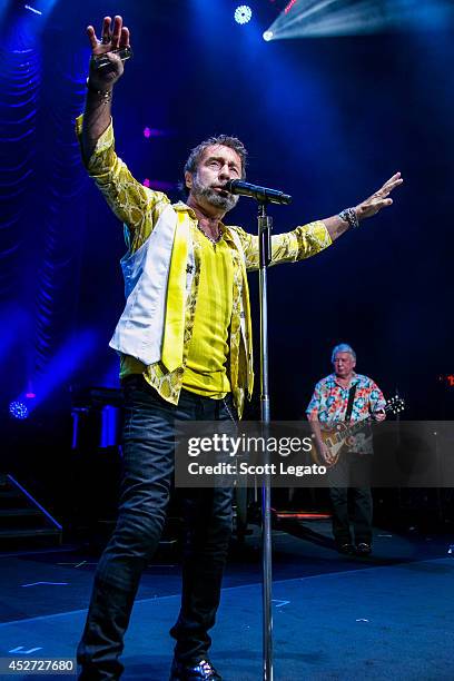 Paul Rodgers Mick Ralphs of Bad Co. Performs at DTE Energy Music Theater on July 25, 2014 in Clarkston, Michigan.