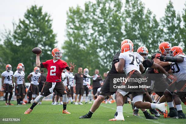 Quarterback Johnny Manziel of the Cleveland Browns runs a play during training camp at the Cleveland Browns training facility on July 26, 2014 in...