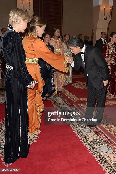 Jury Member Park Chan-Wook is greeted by Princess Lalla Meryem of Morocco and Melita Toscan du Plantier as he attends the Royal Gala Dinner during...