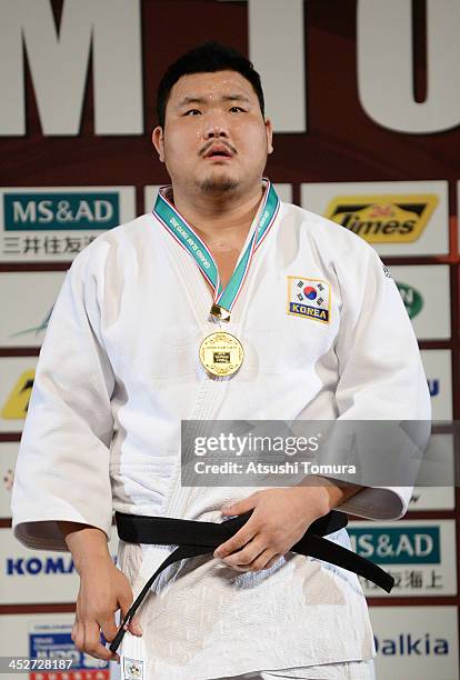 Sung-Min Kim of Korea stands on the podium at the men's +100kg medal ceremony during day three of the Judo Grand Slam at the on December 1, 2013 in...