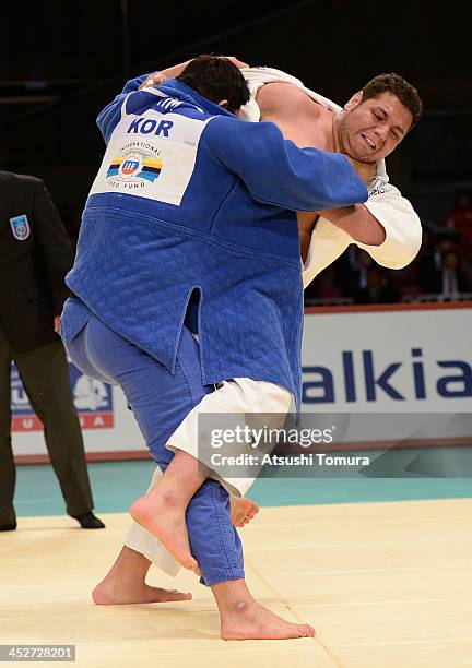 Rafael Silva of Brazil and Sung-Min Kim of Korea compete in the men's +100kg final match during day three of the Judo Grand Slam at the on December...