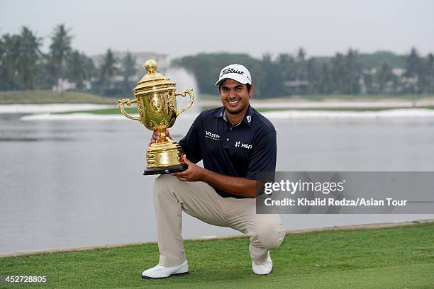 Gaganjeet Bhullar of India poses with the trophy after winning the US$750,000 Indonesia Open during round four of the Indonesia Open at Pantai Indah...