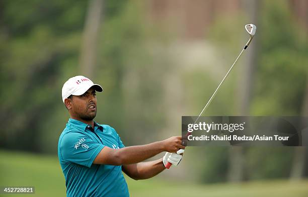 Anirban Lahiri of India plays a shot during round four of the Indonesia Open at Pantai Indah Kapuk on December 1, 2013 in Jakarta, Indonesia.