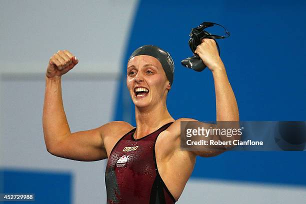 Francesca Halsall of England celebrates winning the gold medal in the Women's 50m Freestyle Final at Tollcross International Swimming Centre during...