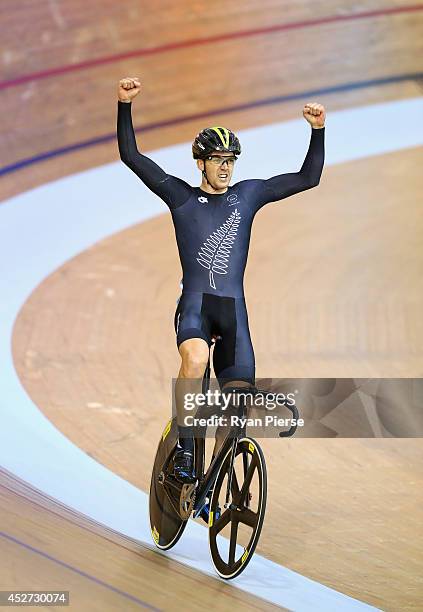 Thomas Scully of New Zealand celebrates after winning Gold in the Men's 40km Points Race at Sir Chris Hoy Velodrome during day three of the Glasgow...