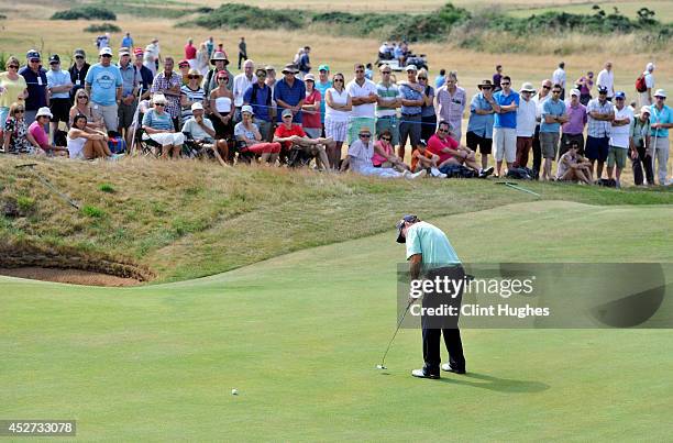 Tom Watson of the United States plays a putt shot on the 8th hole during the third round of the Senior Open Championship at Royal Porthcawl Golf Club...