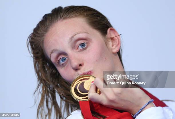 Gold medallist Francesca Halsall of England poses during the medal ceremony for the Women's 50m Freestyle Final at Tollcross International Swimming...