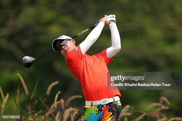 Jazz Janewattananod of Thailand plays a shot during round four of the Indonesia Open at Pantai Indah Kapuk on December 1, 2013 in Jakarta, Indonesia.