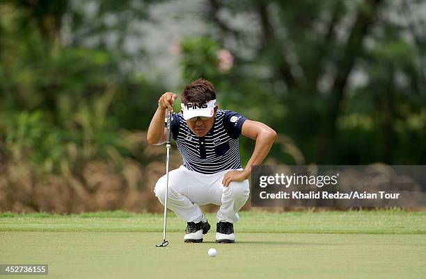 Nicholas Fung of Malaysia plays a shot during round four of the Indonesia Open at Pantai Indah Kapuk on December 1, 2013 in Jakarta, Indonesia.