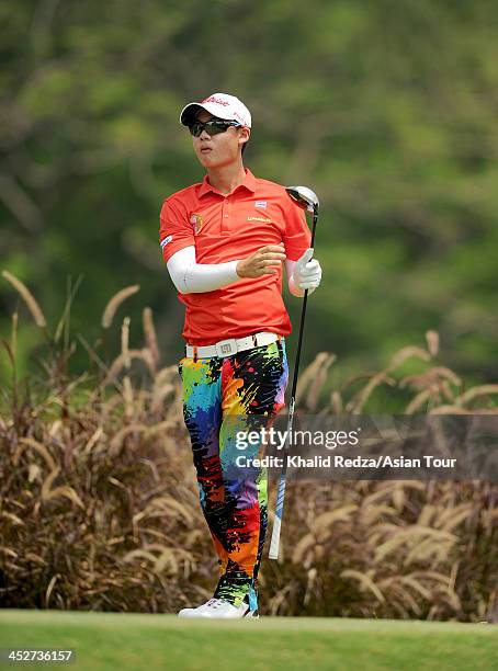 Jazz Janewattananod of Thailand plays a shot during round four of the Indonesia Open at Pantai Indah Kapuk on December 1, 2013 in Jakarta, Indonesia.