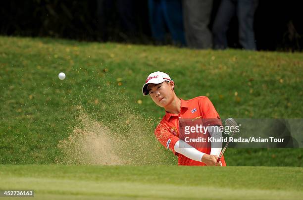 Jazz Janewattananod of Thailand plays a shot during round four of the Indonesia Open at Pantai Indah Kapuk on December 1, 2013 in Jakarta, Indonesia.