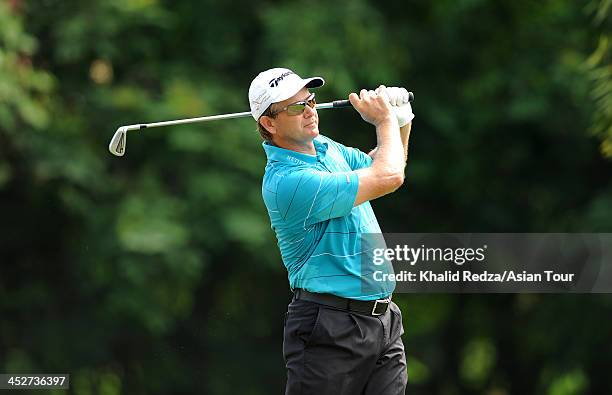 Retief Goosen of South Africa in action during round four of the Indonesia Open at Pantai Indah Kapuk on December 1, 2013 in Jakarta, Indonesia.