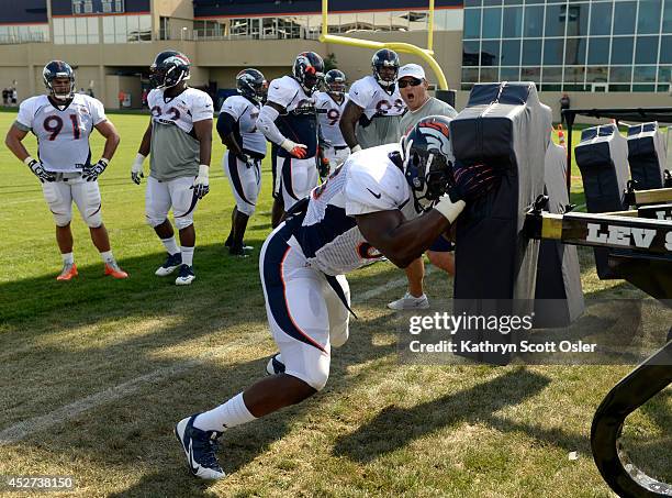 Kenny Anunike runs through drills on Saturday. The Denver Broncos football team hold their workouts for the team during mini-camp at Dove Valley in...