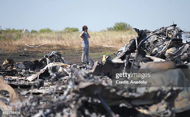 People visit the Malaysia Airlines flight MH17 crash site near the Grabovo town in Donetsk, Ukraine on July 26, 2014.