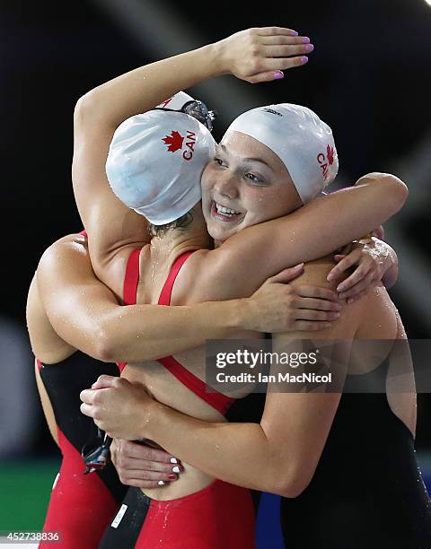 Samantha Cheverton, Brittany McLean, Alyson Ackman and Emily Overholt of Canada celebrate after winning silver in the Women's 4x200m Freestyle Final...