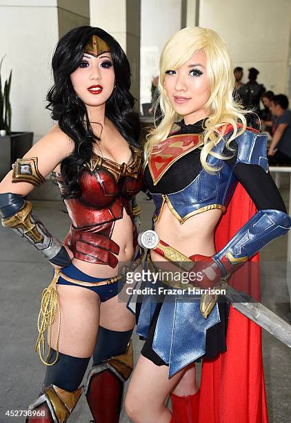 Chubear Cosplay and Stella Chu, portraying Wonder Woman and Supergirl, attend Day 3 of Comic-Con International 2014 on July 26, 2014 in San Diego,...