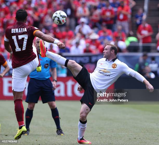 Wayne Rooney of Manchester United in action with Mehdi Benatia of AS Roma during the pre-season friendly match between Manchester United and AS Roma...