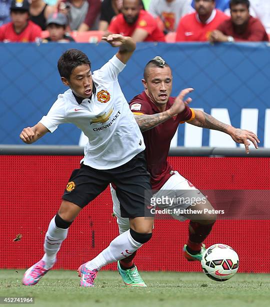 Shinji Kagawa of Manchester United in action with Radja Nainggolan of AS Roma during the pre-season friendly match between Manchester United and AS...
