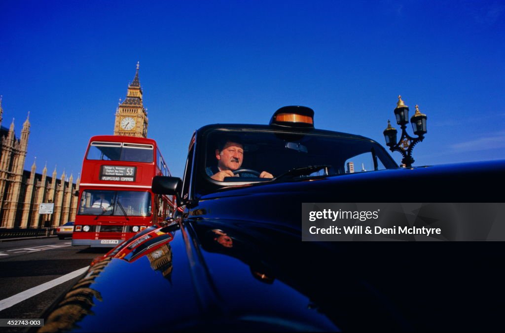 England, London, taxi on Westminster Bridge (wide angle)