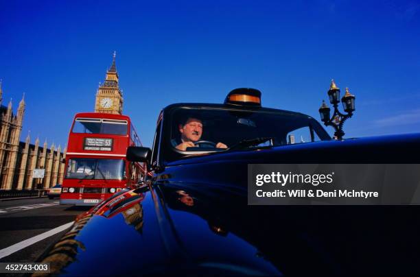 england, london, taxi on westminster bridge (wide angle) - london taxi stock pictures, royalty-free photos & images